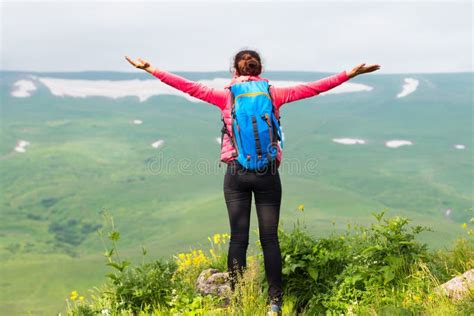 Happy Woman Hiker With Her Arms Outstretched Freedom And Happiness