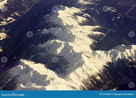 Snow Capped Mountain Range From Above Stock Photo Image Of Sidelit