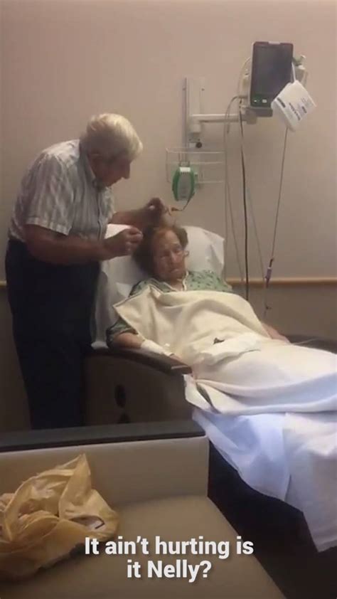 Devoted Husband Combs Hair Of Sick Wife Elderly Man Gently Combs His Sick Wifes Hair This Is