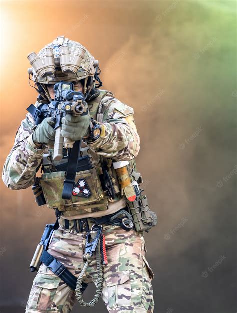 premium photo soldiers in special forces army soldier in protective combat uniform holding