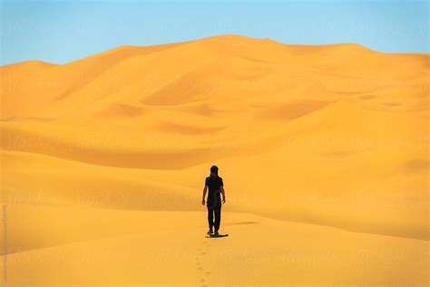 Man Walking On A Dunes In Desert By Stocksy Contributor Alexander