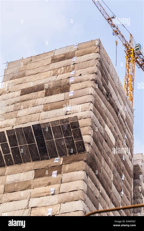 A Skyscraper Under Construction Or Renovation With Scaffolding Stock