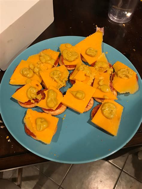 nothing like some ritz crackers with some pepperoni cheese and spicy mustard on top to make a