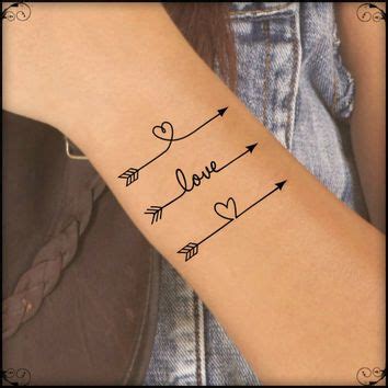 Yet another meaning for the humble arrow is strength. Three Arrows With Love And Heart Tattoos On Wrist | Arrow tattoo on wrist, Fake tattoos, Feather ...