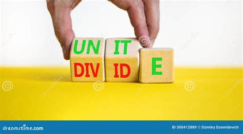 Unite Or Divide Symbol Concept Word Unite Or Divide On Wooden Cubes