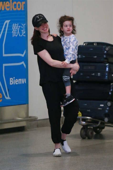 Anne Hathaway Out With Her Son Jonathan Arrives At Jfk Airport In New