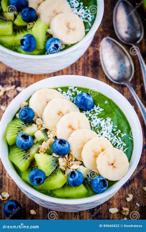 Green Smoothie Bowl With Banana Kiwi Blueberry Granola And Coconut