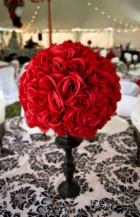 A black and white themed wedding is elegant and versatile. Red and black wedding. Damask. Centerpiece. Rose ...
