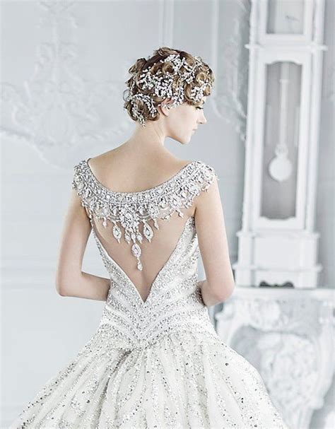 Along with many styles on wedding dresses, a lace wedding dress is one of the most popular and it gives endless romantic image to the bride. The Wedding Dress with a Dramatic Back | Arabia Weddings