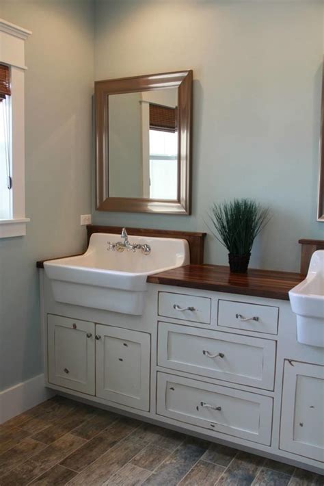 A dark wood vanity and storage cabinet add a striking contrast in. 37 Stunning Bathroom Vanity Farmhouse Furniture Ideas ...