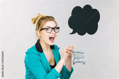 Happy Business Woman Holding Small Tiny Shopping Cart Stock Photo