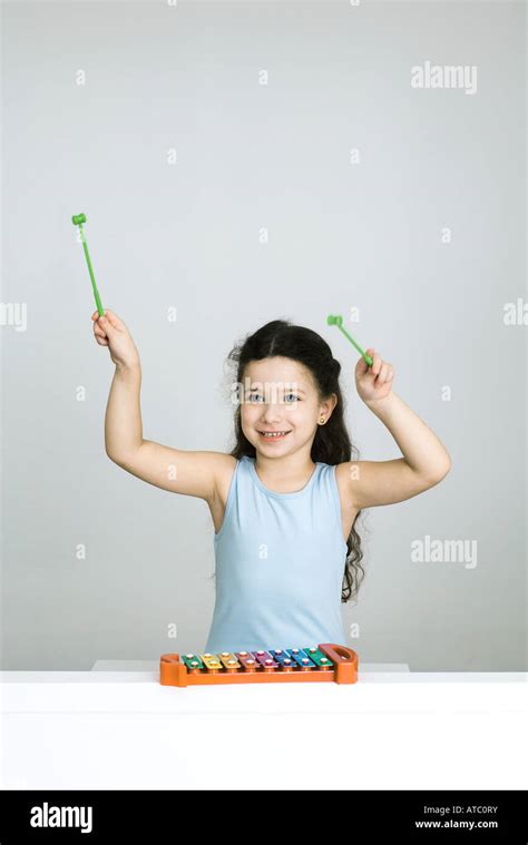 Little Girl Playing Xylophone Arms Raised Smiling Stock Photo Alamy