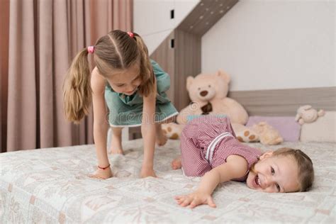 Cute Girls Play On The Bed In The Room Stock Image Image Of Comfort Little 188754031