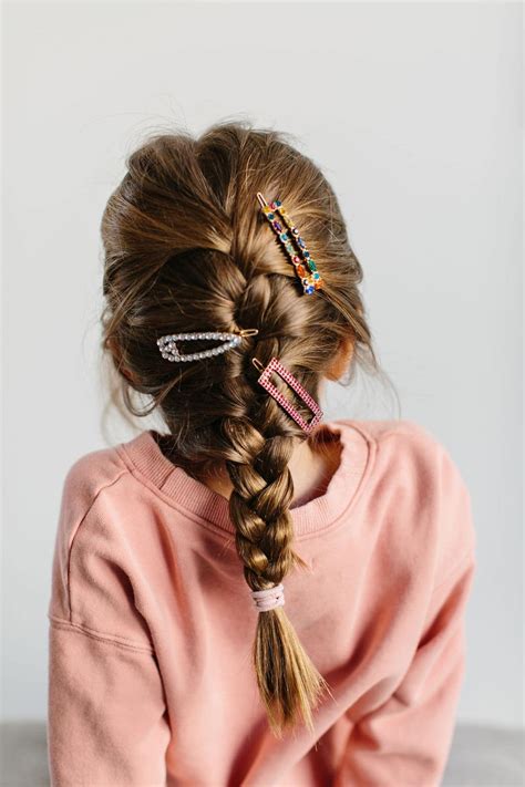 Section your hair centrally and twist it. 3 Easy Hairstyles for Kids: Braids, Buns, and Wavy Hair — The Effortless Chic