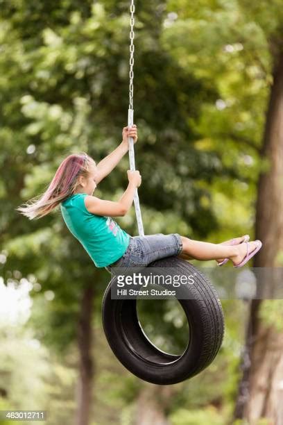 Girl On Tire Swing Photos And Premium High Res Pictures Getty Images
