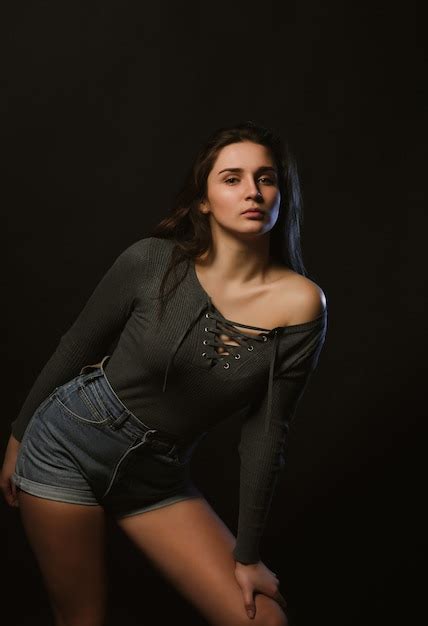 Premium Photo Model Test Shoot Of Seductive Woman Posing In Dark Studio