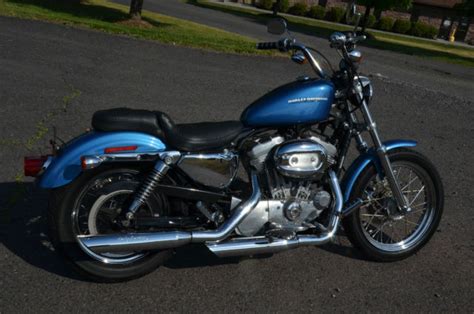 Stop the engine when refueling or servicing the fuel system. 2005 Blue Harley Davidson Sportster XL883L XL 883 L Low ...