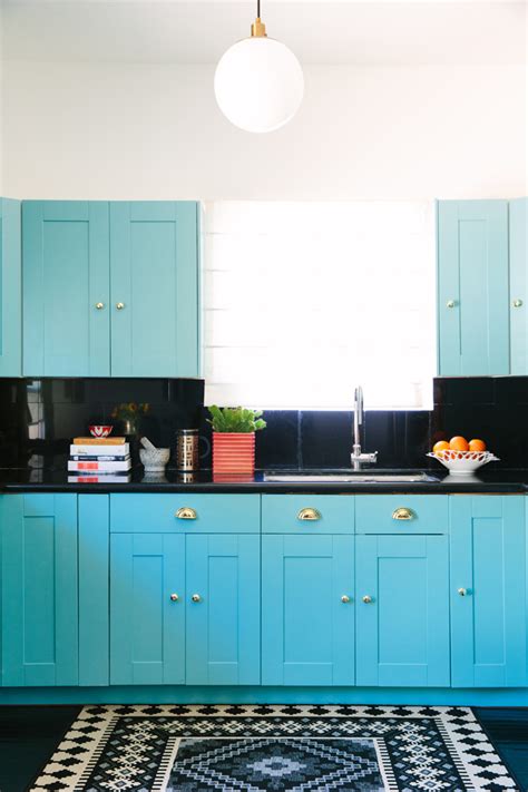 This lacquer gloss kitchen cabinets use bright tones (white and rose red) you can feel this. Black Lacquer Design | House of Turquoise