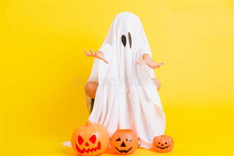 Little Cute Child With White Dressed Costume Halloween Ghost Scary He