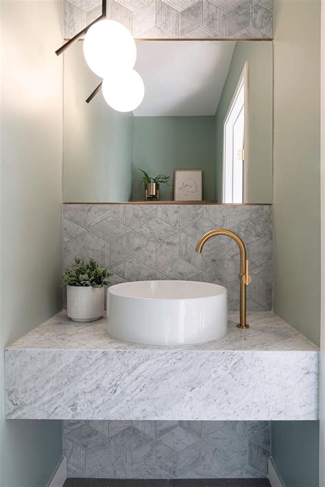 In This Small But Modern Powder Room Tile With A Textural Bamboo Like