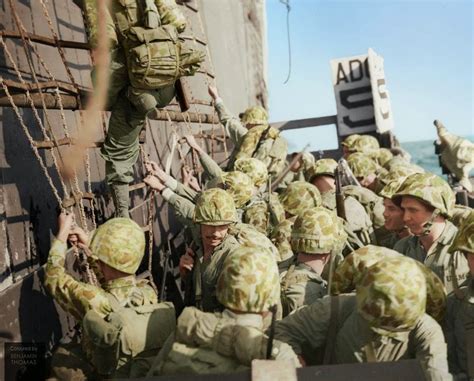 Wwii Colorized United States Marines Climbing Down The Nets Into