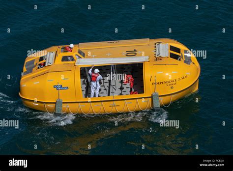 A Yellow Lifeboat From The Royal Caribbean Independence Of The Seas Cruise Ship Being Driven