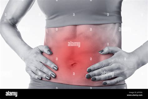 Close Up Of A Womans Abdomen With Menstrual Pain Isolated On White