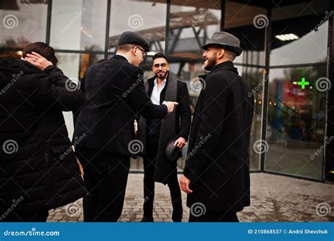 group of handsome retro well dressed man gangsters smoking outdoor multiethnic male bachelor