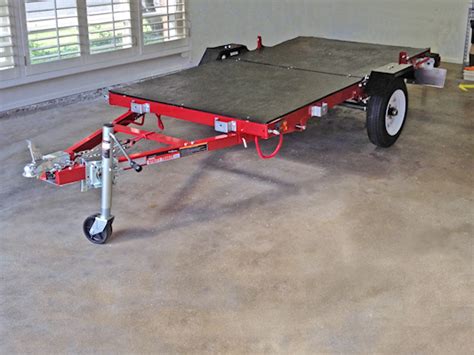 This is the inexpensive folding 4'x8' haulmaster 1200 lb flatbed trailer (deck not included) that goes for about $300 at harbor freight. Haul Master Folding Trailer completed | Kayak trailer | Pinterest | Kayak trailer