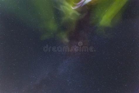 Northern Green Lights Aurora Borealis With Night Sky And Many Stars