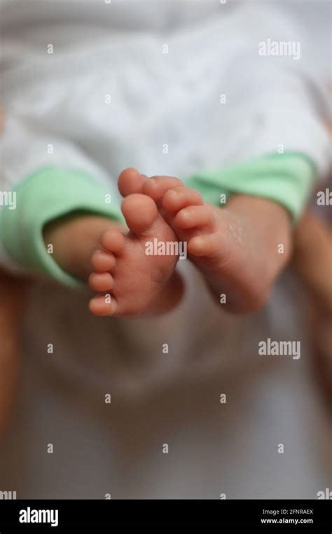 Newborn Feet Touching Stock Photo Alamy