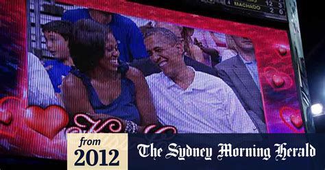 video obamas caught on kiss cam
