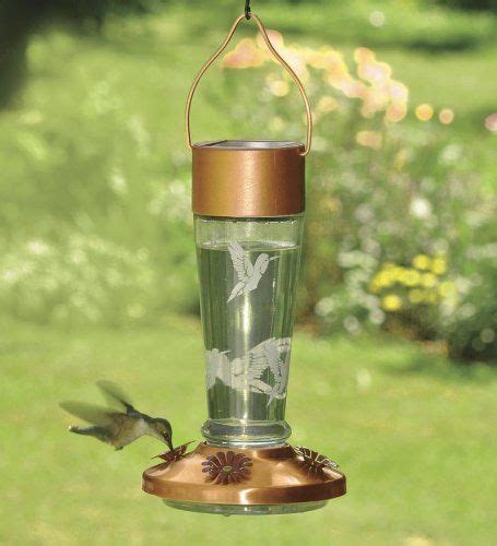 Useful during the day, entertaining all who love to watch the great activity. Solar Powered Lighted Hummingbird Feeder: solar panel ...