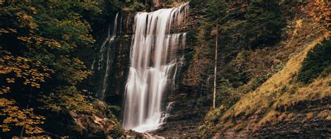 Download Wallpaper 2560x1080 Waterfall River Rock Trees Landscape
