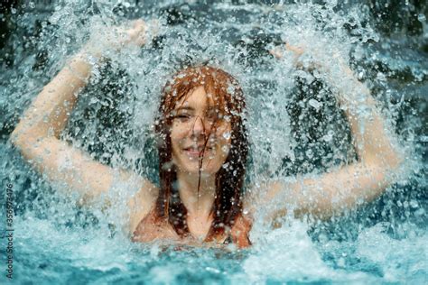 Beautiful Young Sexy Redhead Woman In Bikini Under The Splashing Water
