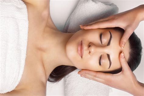 Premium Photo Face Massage Closeup Of Young Woman Getting Spa Massage Treatment At Beauty Spa