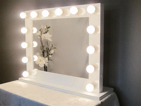 We love its sleek and understated design that will look great on just about any vanity table. Grand Hollywood Lighted Vanity Mirror w/ LED Bulbs by ...