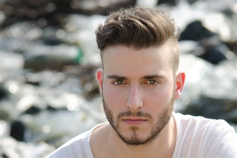 This versatile cool haircut is a variation of the short on sides, long on top hairstyle, and may be one way to minimize the attention to your receding hairline. Men's Hair Trend: Short Sides, Disconnected Top