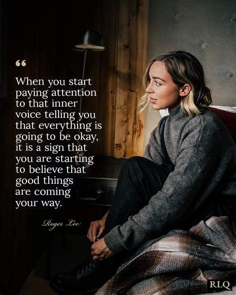 A Woman Sitting On Top Of A Bed Next To A Wall With A Quote Above It