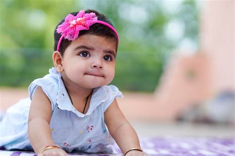 Premium Photo Indian Baby Girl Child Playing And Giving Smile