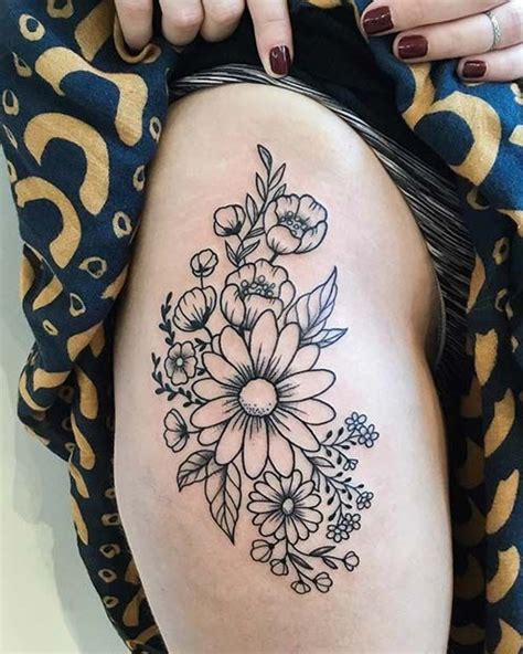 flower thigh tattoos