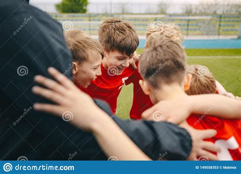 Group Of Happy Boys Making Sports Huddle Smiling Kids Standing