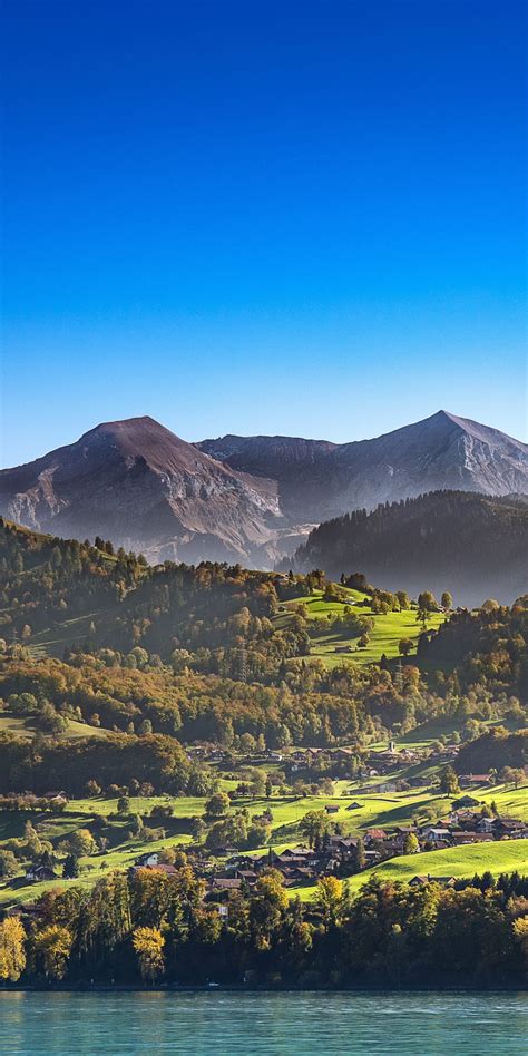 Download 1080x2160 Wallpaper Sunny Day Mountains Landscape Blue Sky