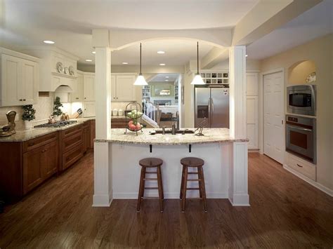 The central island, topped with calacatta marble, stands. Home Addition Design Ideas | Project Photos and Descriptions