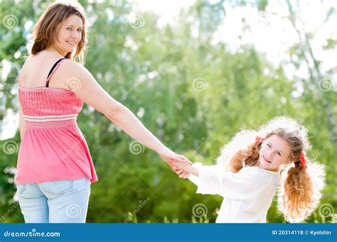 Young Mother Walking With Her Daughter Stock Photo Image Of Beauty