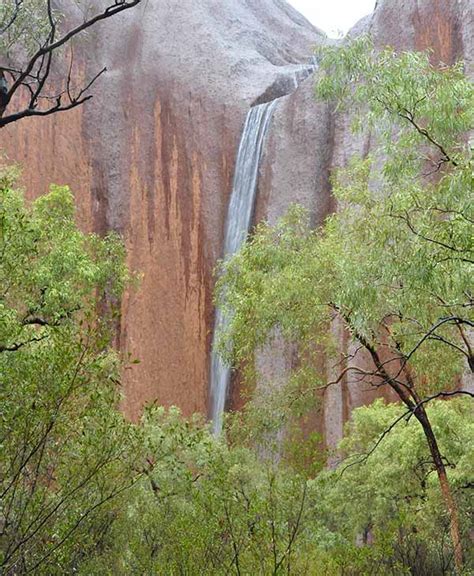 Unseasonable Rain Causes Waterfalls Over Australias Famed Uluru