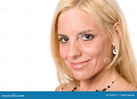 mature blond woman with in optical store trying on eyeglasses royalty free stock image