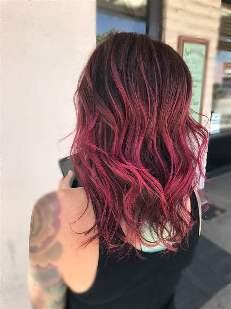 A perfectly smooth bob haircut on black hair embellished by subtle balayage highlights in complementary colors that everyone can rock. Cupid hair color by pulpriot magenta pink Balayage | Pink ombre hair