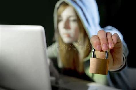 Teenager Hacker Girl In Hood Using Mobile Phone In Internet Cyber Crime