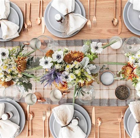 A wooden bowl with blooms, persimmons, pears and candles in wooden stumps plus nuts and leaves around. 55 Thanksgiving Table Settings - Thanksgiving Tablescapes ...
